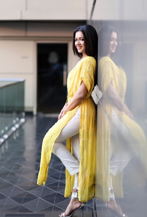 Catherine Tresa Yellow Dress Interview Pics