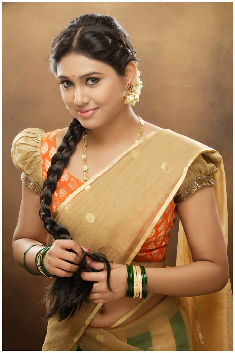 Manisha Yadav Gold Color Dress Glamour Photos