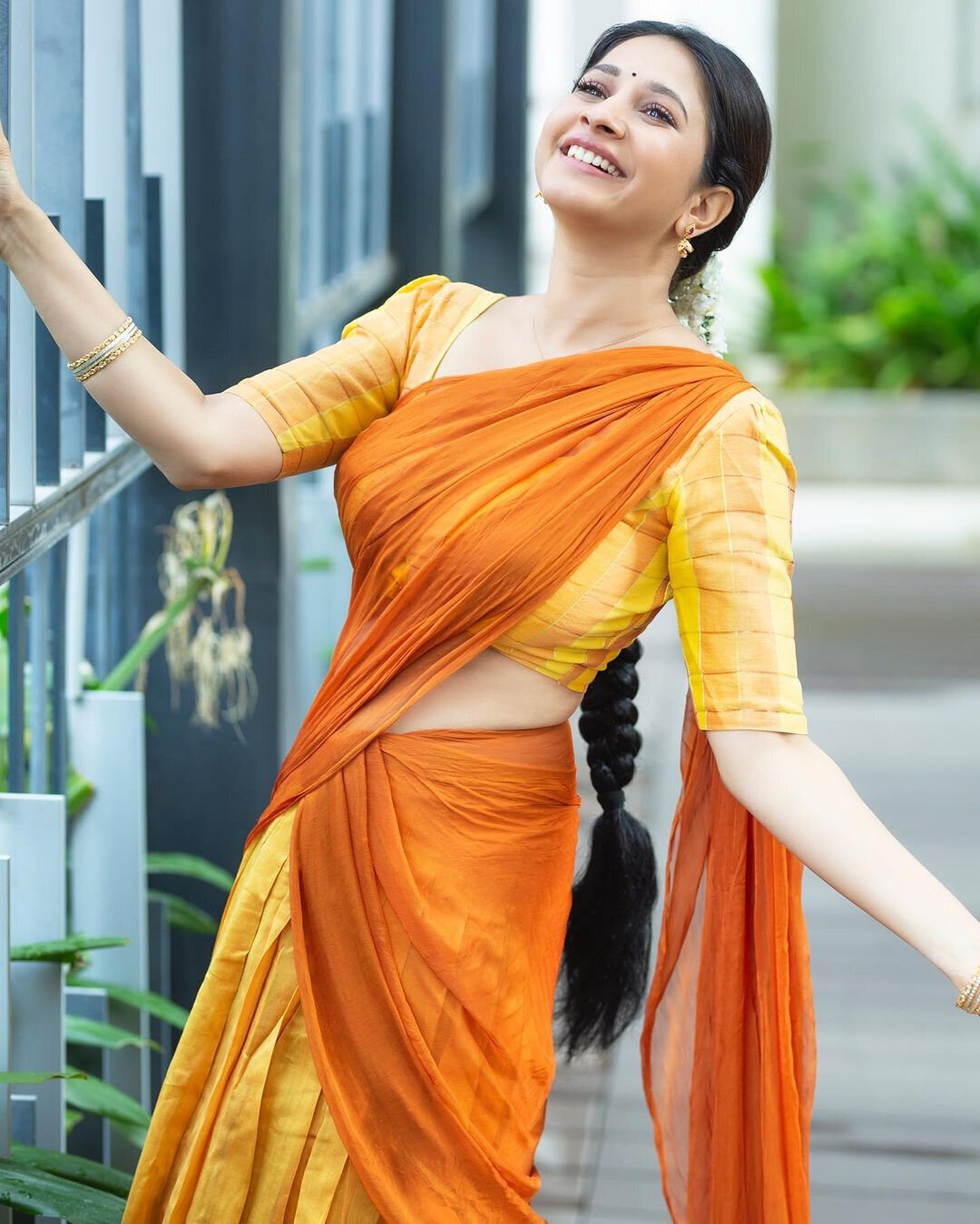 Actress Manvita Kamath In Orange Saree